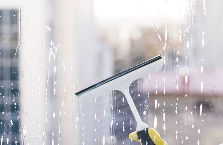 man-cleaning-window